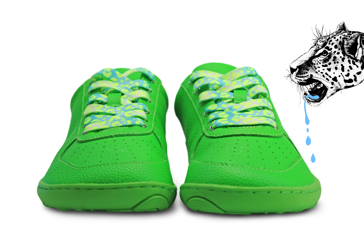Green sneakers with colorful laces on a white background, with a leopard illustration in the corner.