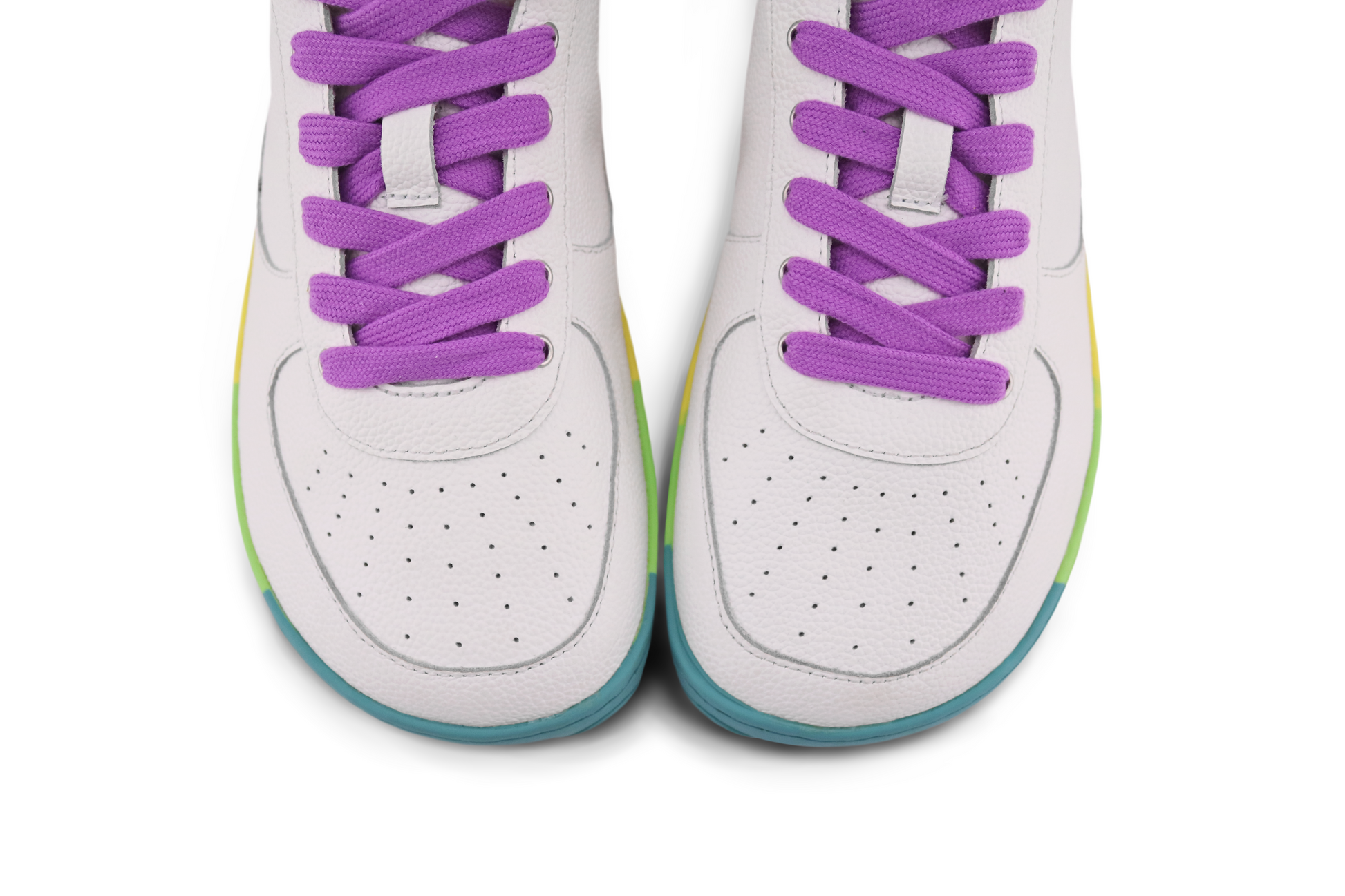 VIEW LOOKING DOWN ON THE TOES OF PAPERKRANE RAINBOW SOLED WHITE SNEAKERS