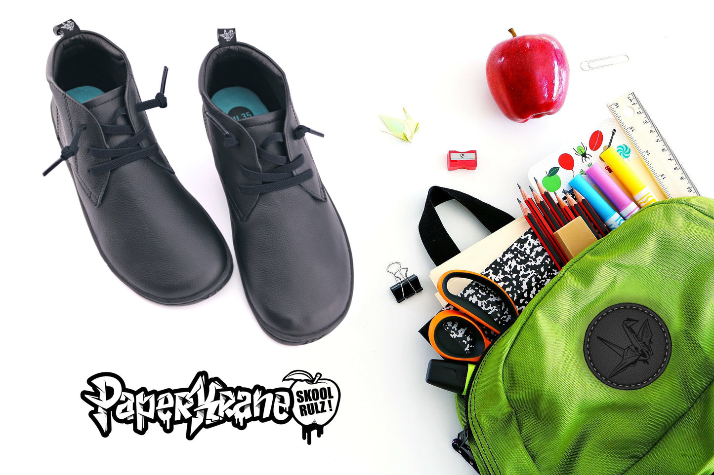 Black PaperKrane barefoot ankle boots with elastic laces on white background and school bag