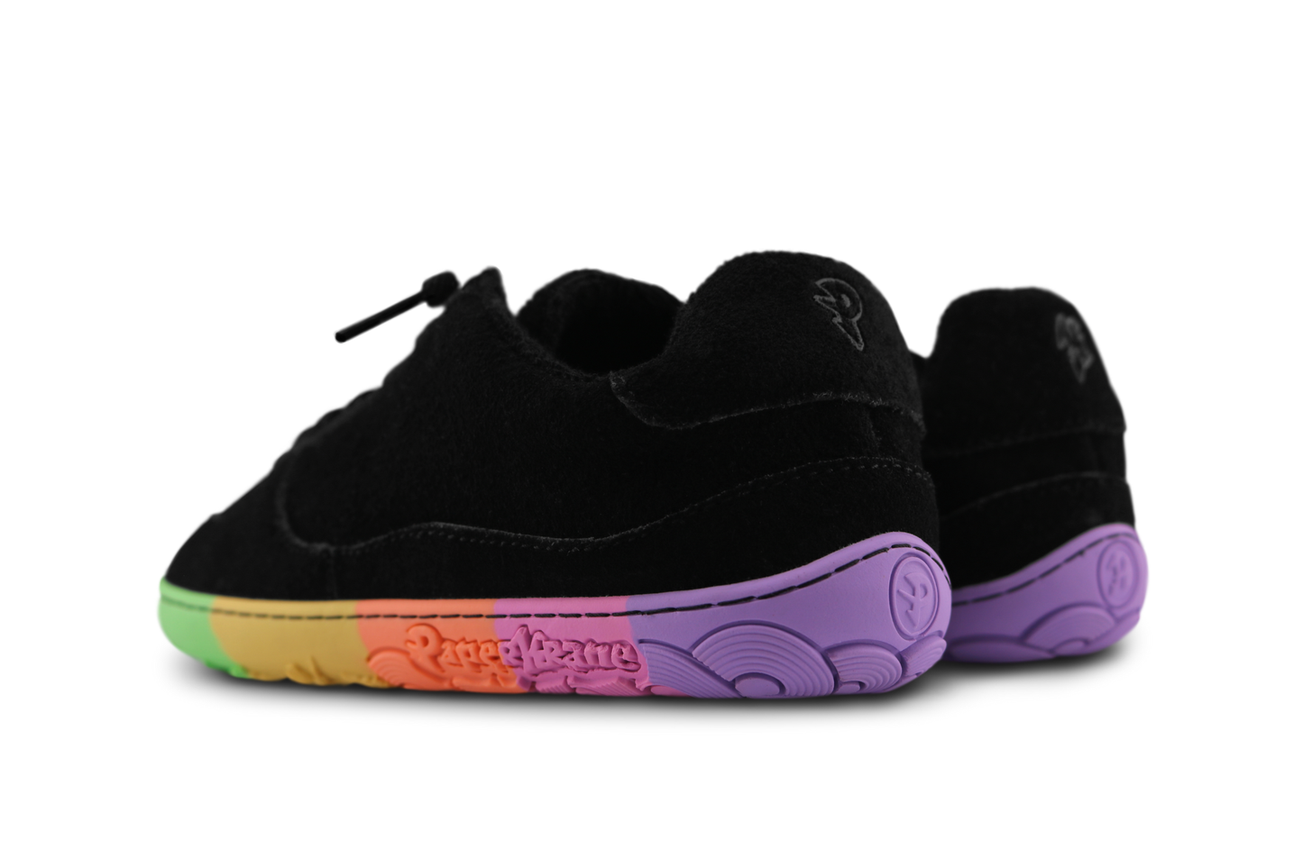 Black sneakers with colourful sole on a white background