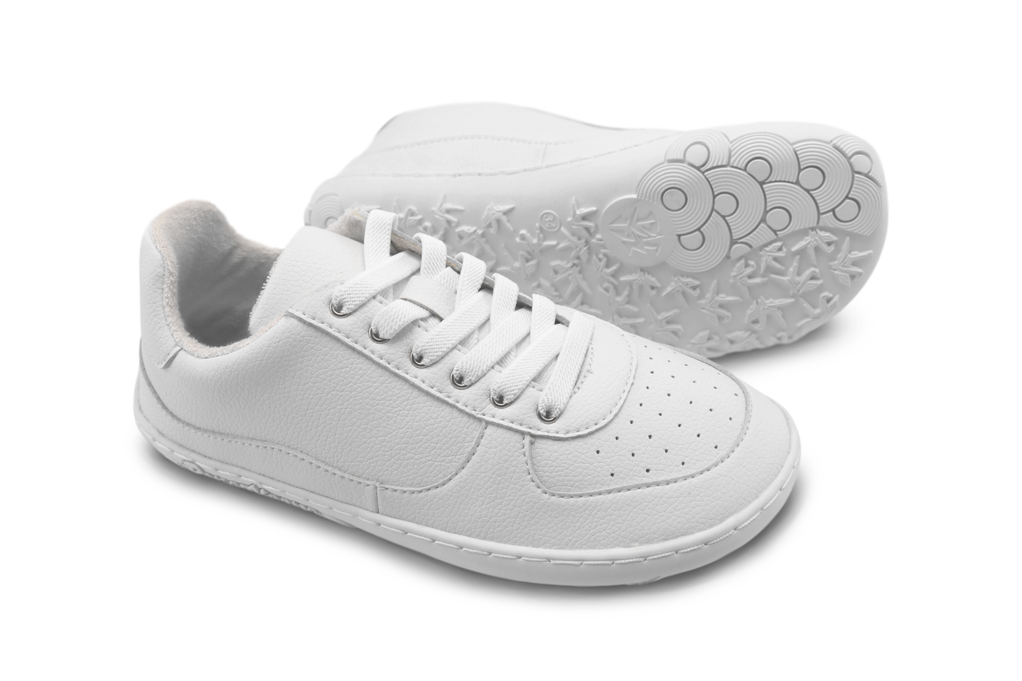 White sneakers with elastic laces on a white background