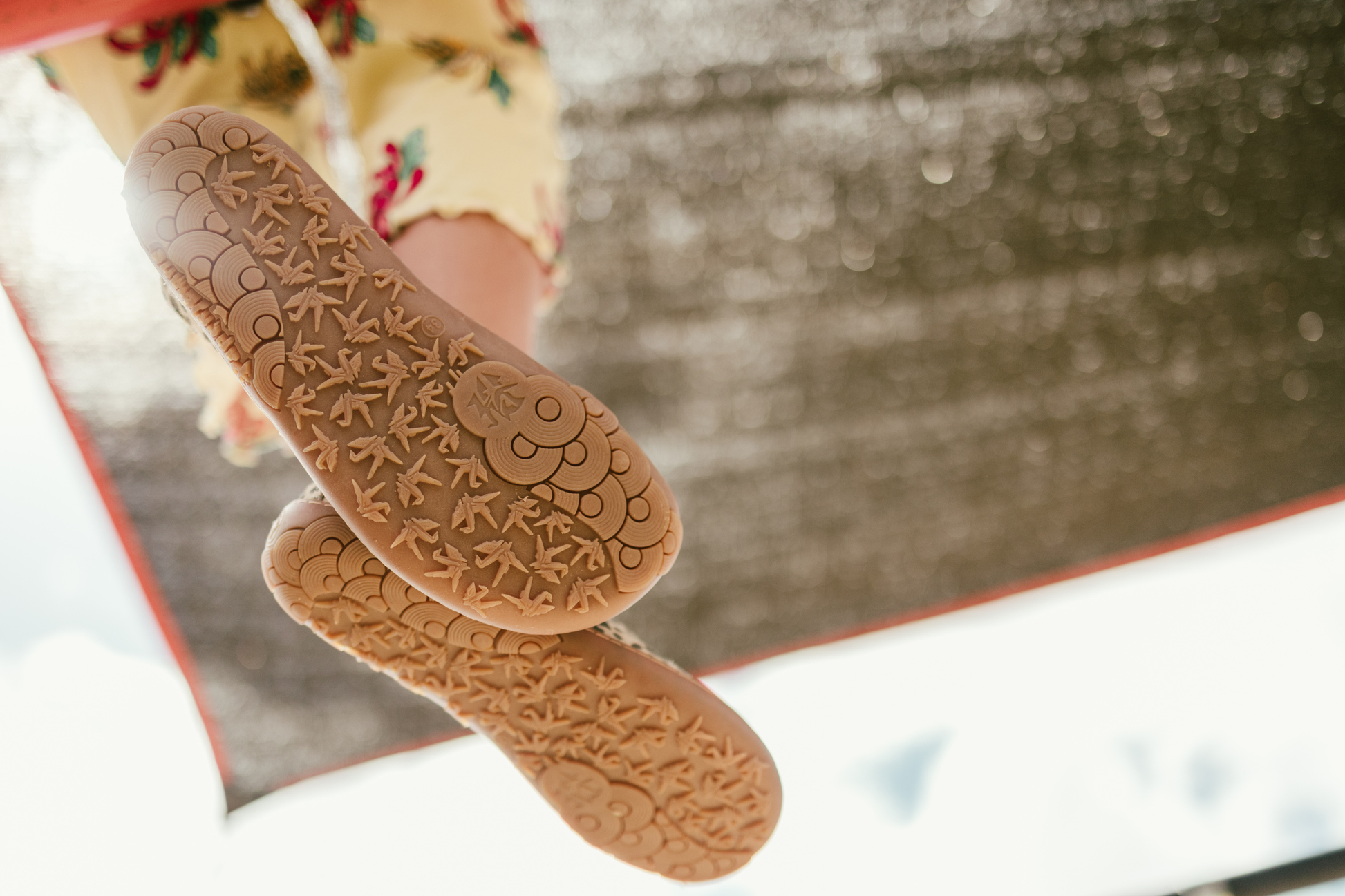 Close-up of gum rubber textured foot-shaped PaperKrane soles from below