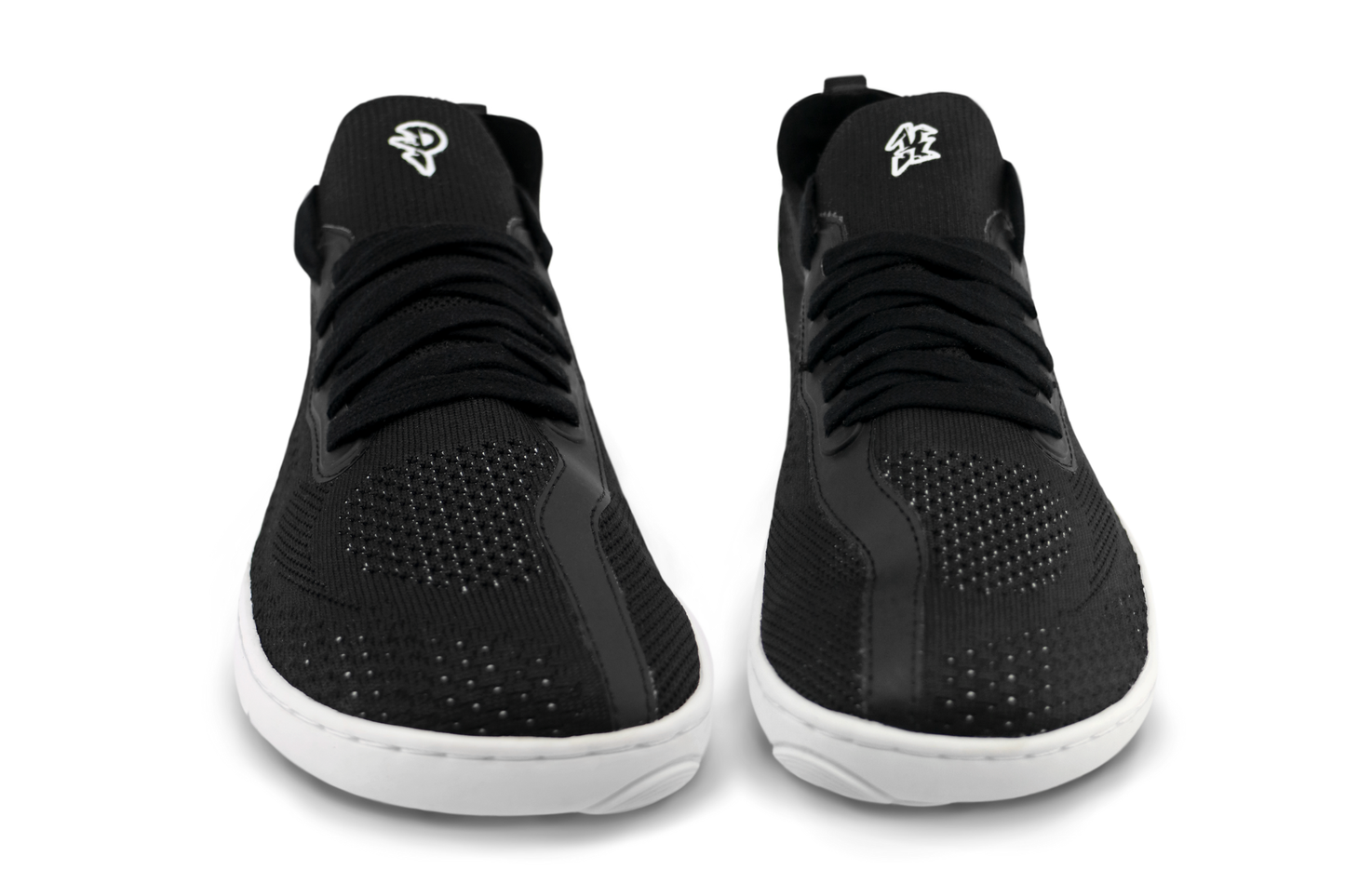 Black PaperKrane AKTIVE sneakers with white soles on a white background