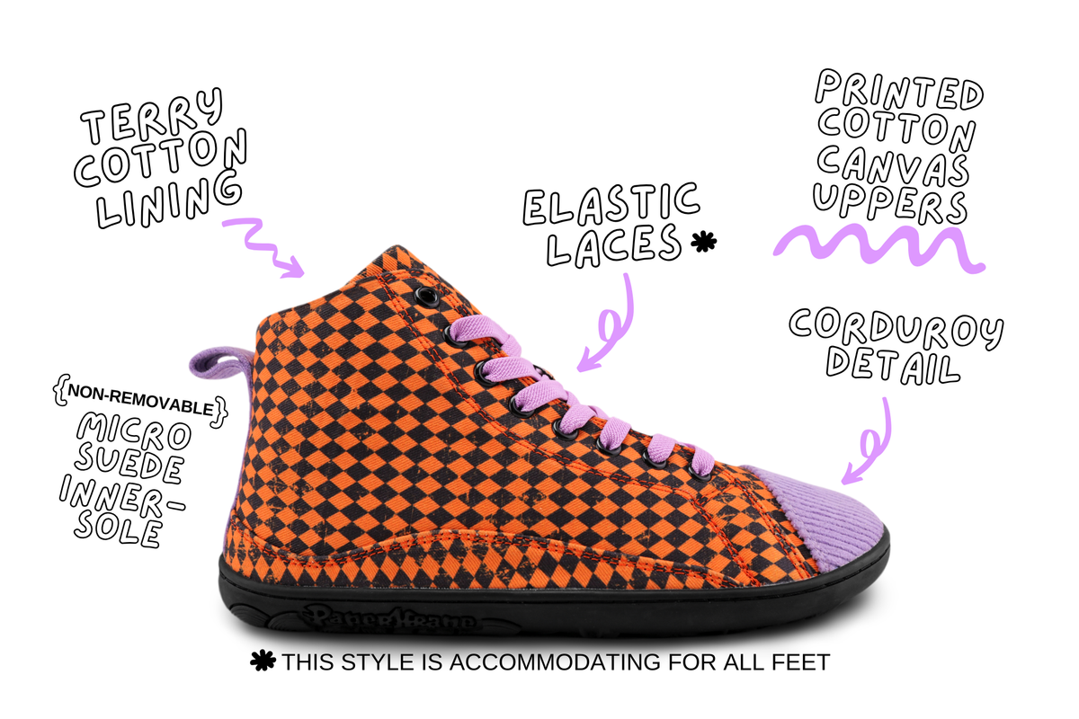A high-top PaperKrane sneaker with an orange and black checkered pattern, purple elastic laces, and a purple toe cap, shown on a white background with handwritten callouts pointing to features like terry cotton lining, elastic laces, printed canvas uppers, corduroy detail, and micro suede inner sole.