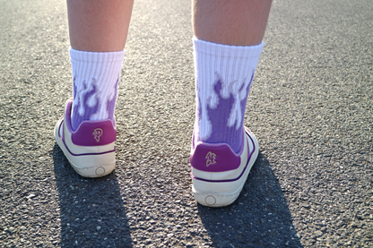 Back view of PLUM sneakers on feet on the street
