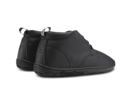 Black PaperKrane barefoot ankle boots from back on white background