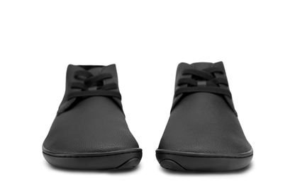 Black PaperKrane barefoot ankle boots from front with elastic laces on white background