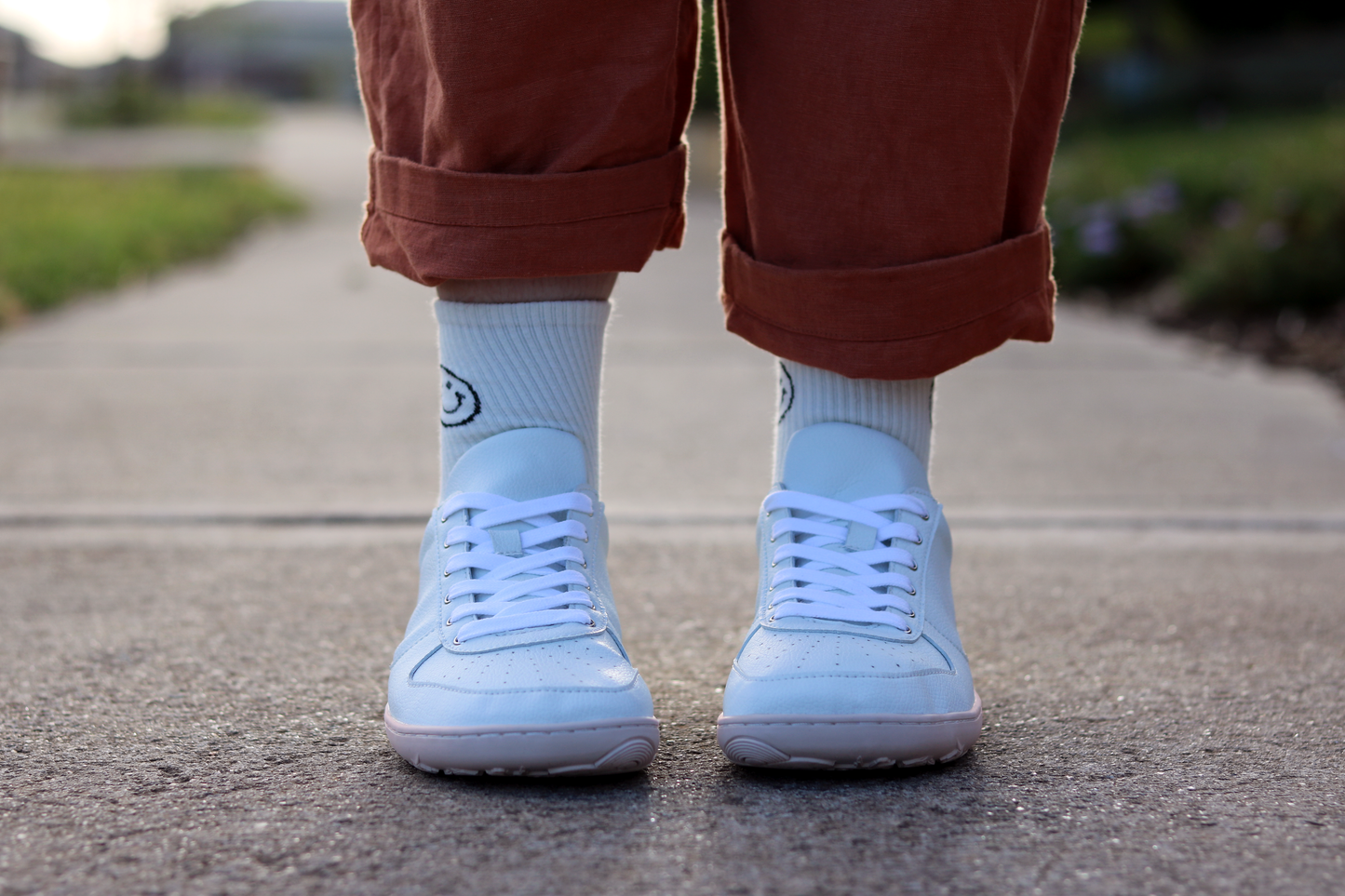 Front view of PaperKrane Camel Toe sneakers on feet. 