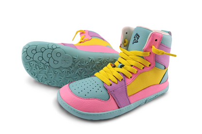 Colourful high-top sneakers with pink, yellow, and blue design on a white background