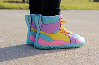 Colourful high-top sneakers with a PaperKrane logo on a road.