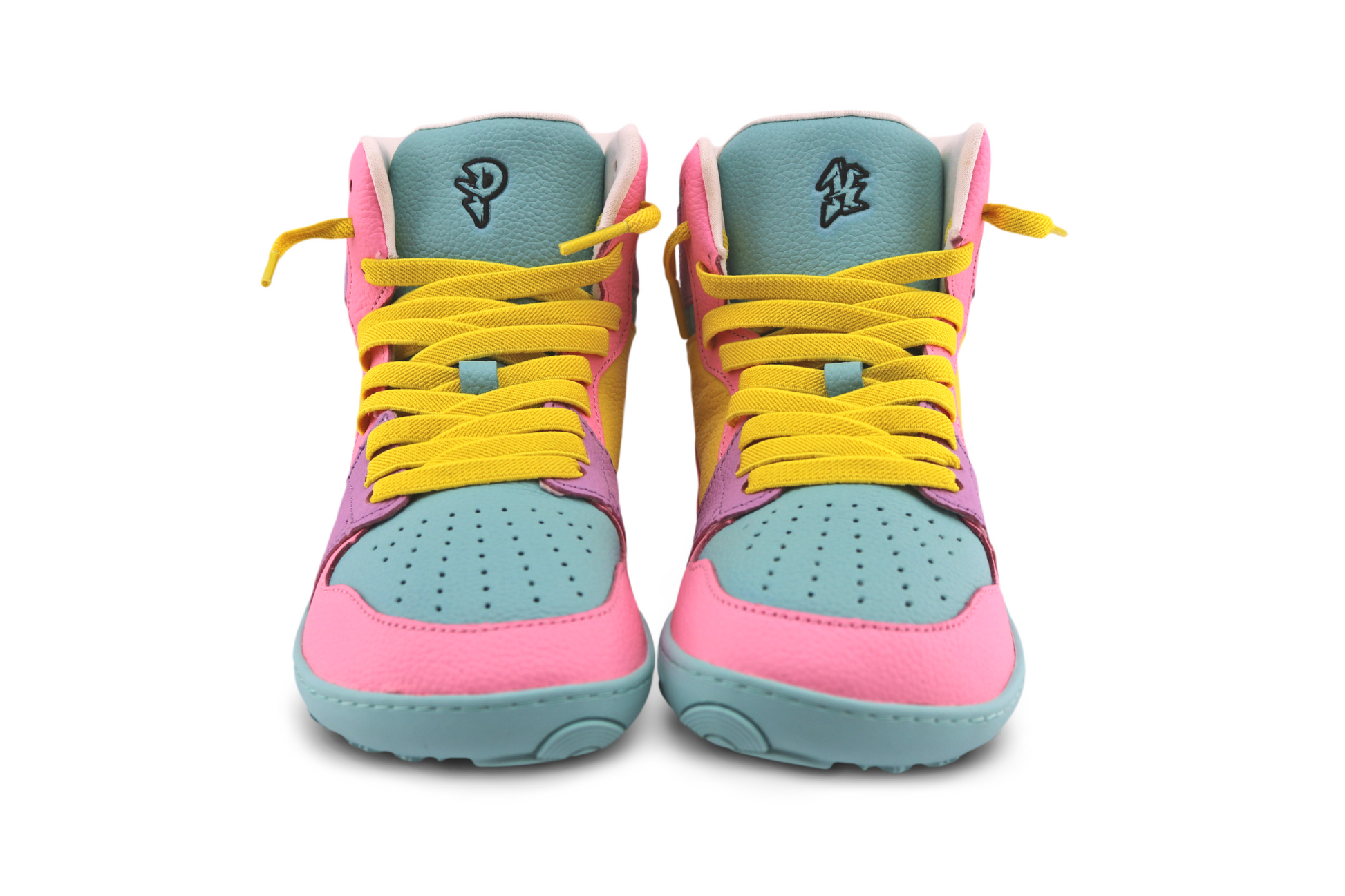 Pair of colourful high top sneakers with pink, yellow, and blue design on a white background