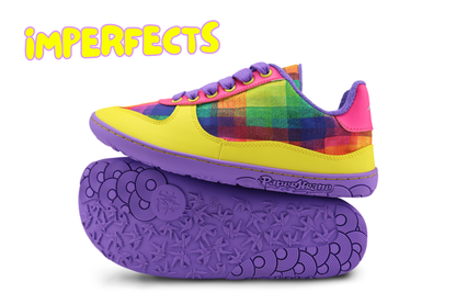 A vibrant multicolour low-top barefoot sneaker with a yellow toe box, rainbow plaid upper, pink heel tab, and purple sole, shown alongside its matching purple textured outsole. The word "IMPERFECTS" is written in the upper left corner. Please read the product description to see why. 