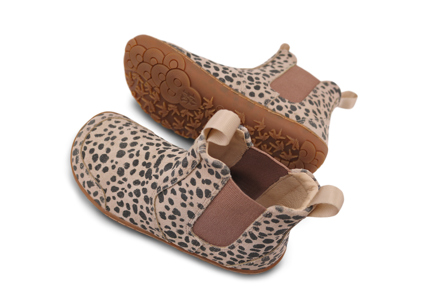A pair of beige and charcoal suede  cheetah chelsea boots by PaperKrane. Tee boots are on an angle and you can see the upper and sole of this pair, on a white background. 