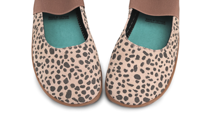 Pair of cheetah print shoes with turquoise lining on a white background
