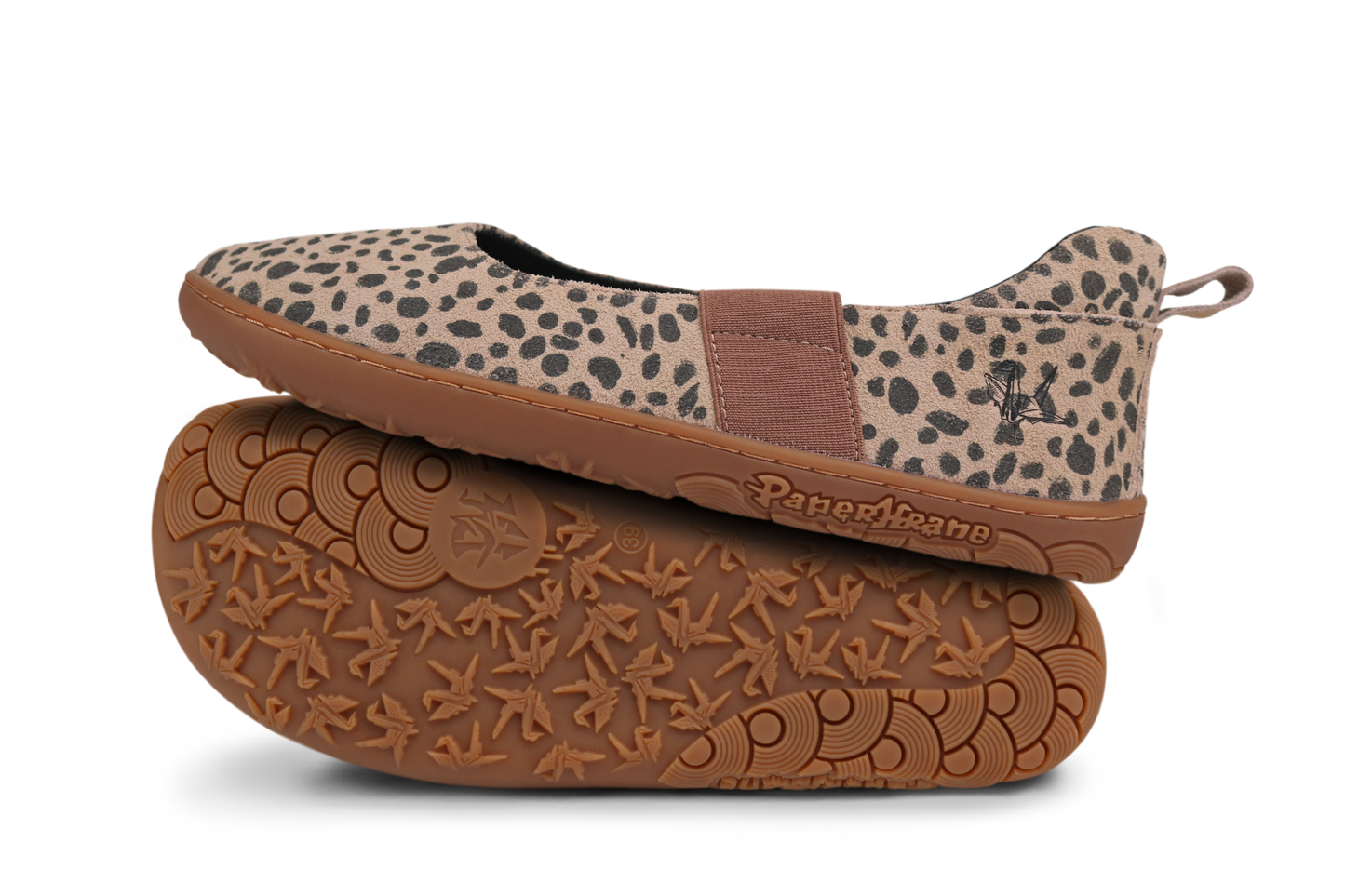 Pair of cheetah print shoes with gum soles on a white background