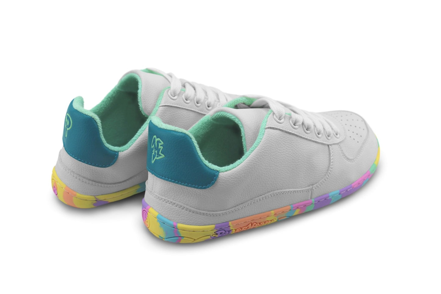 A pair of low-top PaperKrane barefoot sneakers in white vegan leather with teal accents on the heel tab and mint terry lining, featuring a colourful pastel rainbow gradient along the outsole.