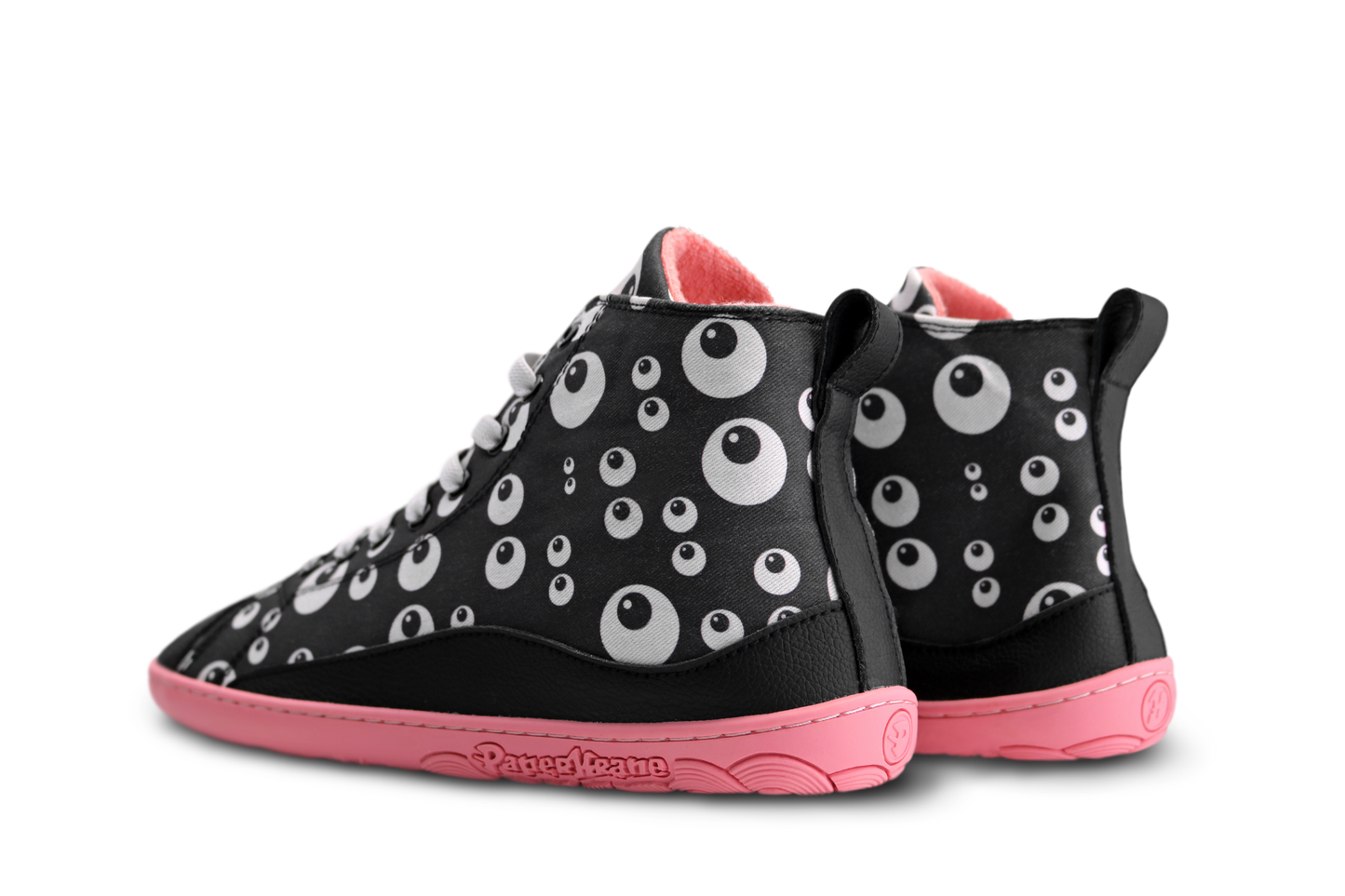 Back view of PaperKrane barefoot boots in black cotton, with cartoon eyeballs, a salmon lining and matching rubber sole. The boots are on a white background, and you can see a little bit of their elastic laces. 