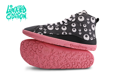 Black PaperKrane barefoot hightop with cartoon eyeball print, on a salmon coloured rubber sole. The boots are on a white background with a teal "limited edition" in the top left corner. 