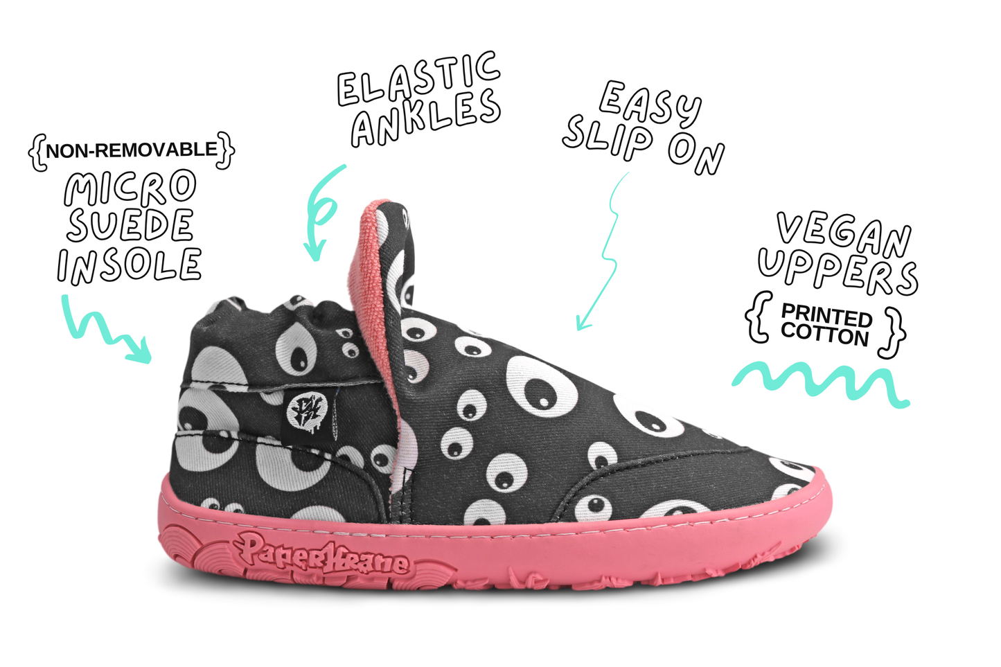 Side view of one Eyeball Signature slip on shoe. These flat and flexible shoes are perfect for kids, you can see the cartoon eyeball print, and salmon sole and lining of this pair. The image is on a white background with product details around it. 