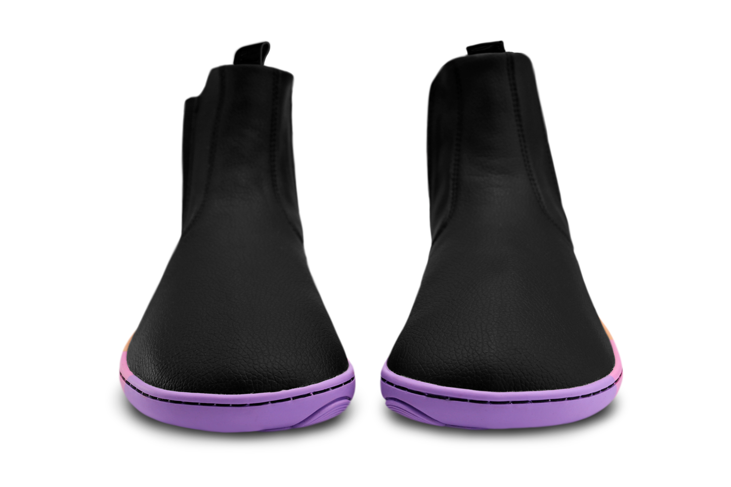 Black vegan leather chelsea boots from the front with wide toe box by PaperKrane, they have a rainbow sole on a white background. 