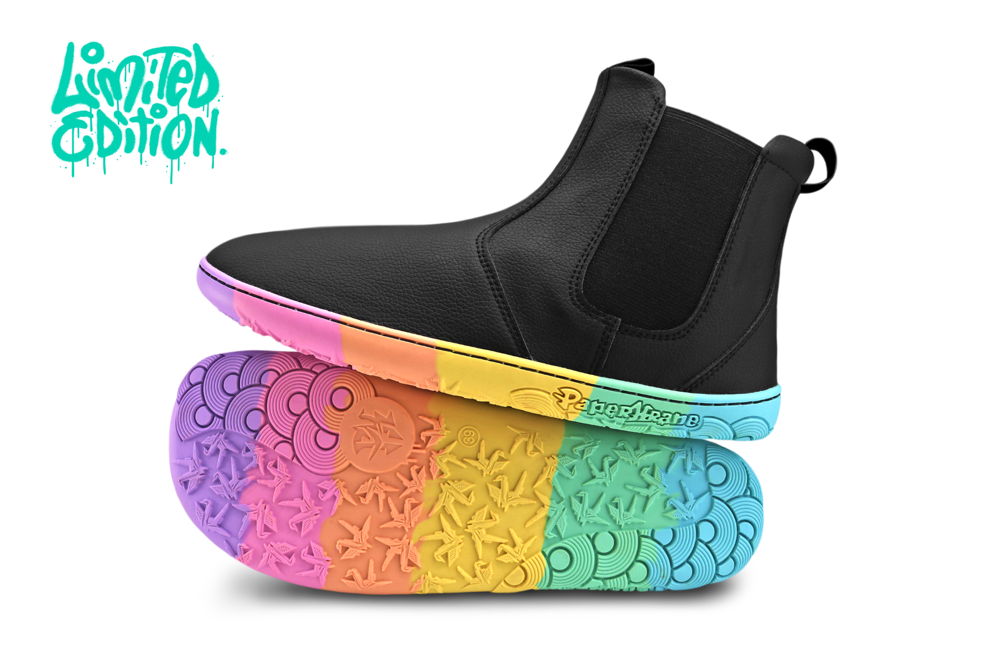 Black vegan leather chelsea boot from PaperKrane with rainbow foot-shaped sole on a white background with the text, "Limited Edition" in the top left corner. 