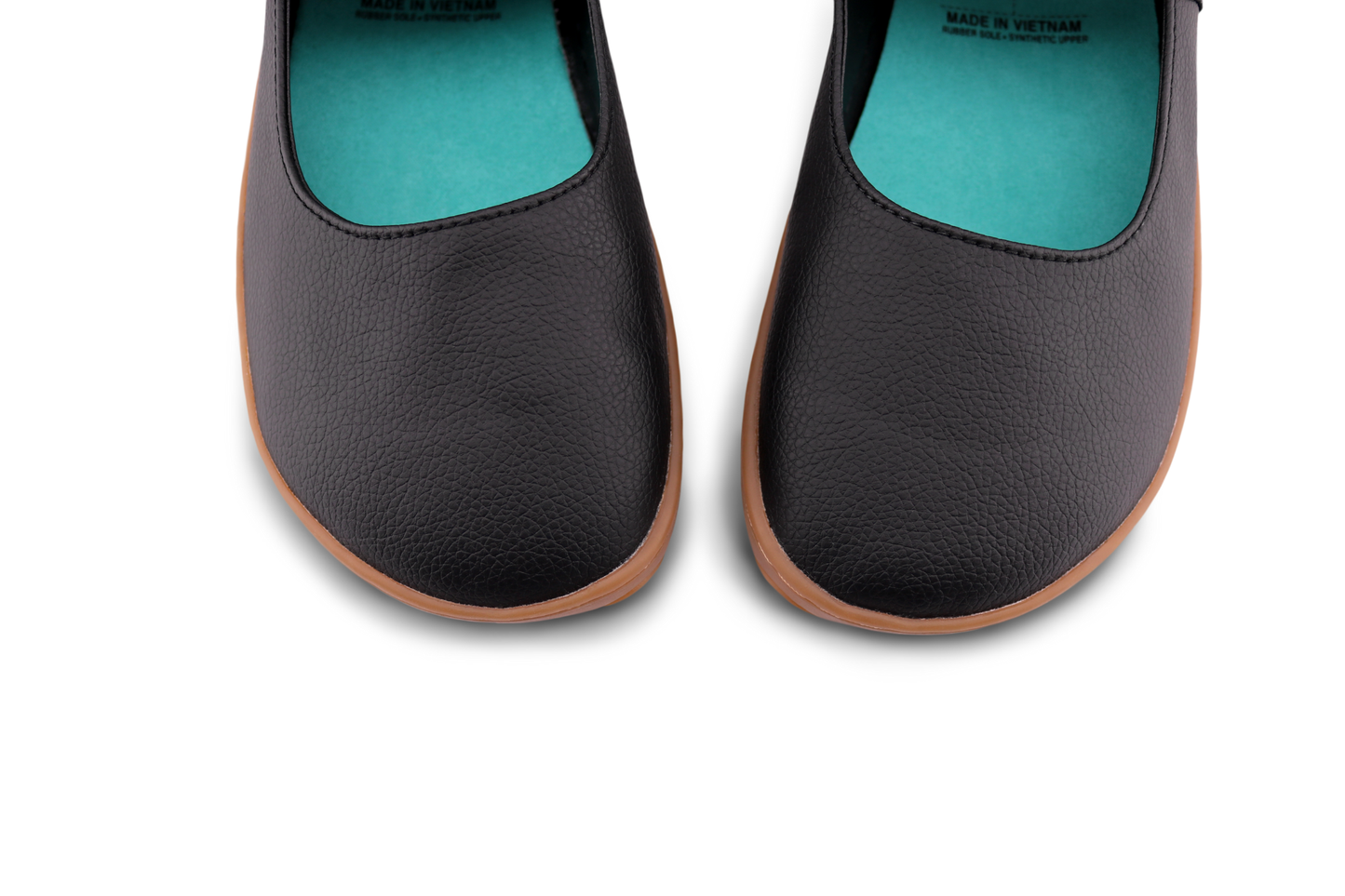 Licorice MJ toes up close on a white background. With a teal insole colour. 