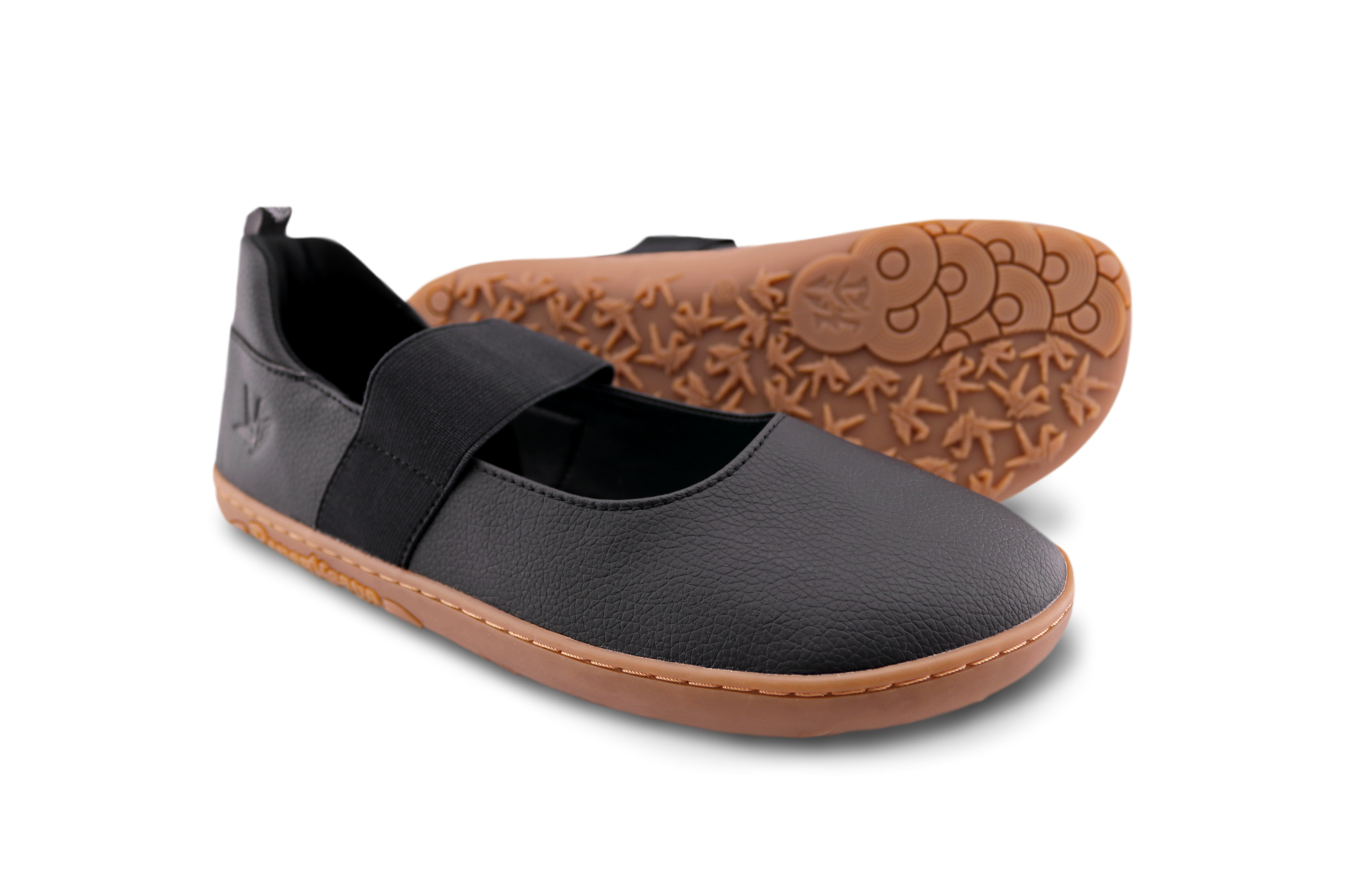 Product shot of black and gum PaperKrane mjs on an angle on white background. 