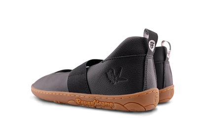 Rear view of PaperKrane Licorice MJs. A black vegan maryjane with gum soles on white background.