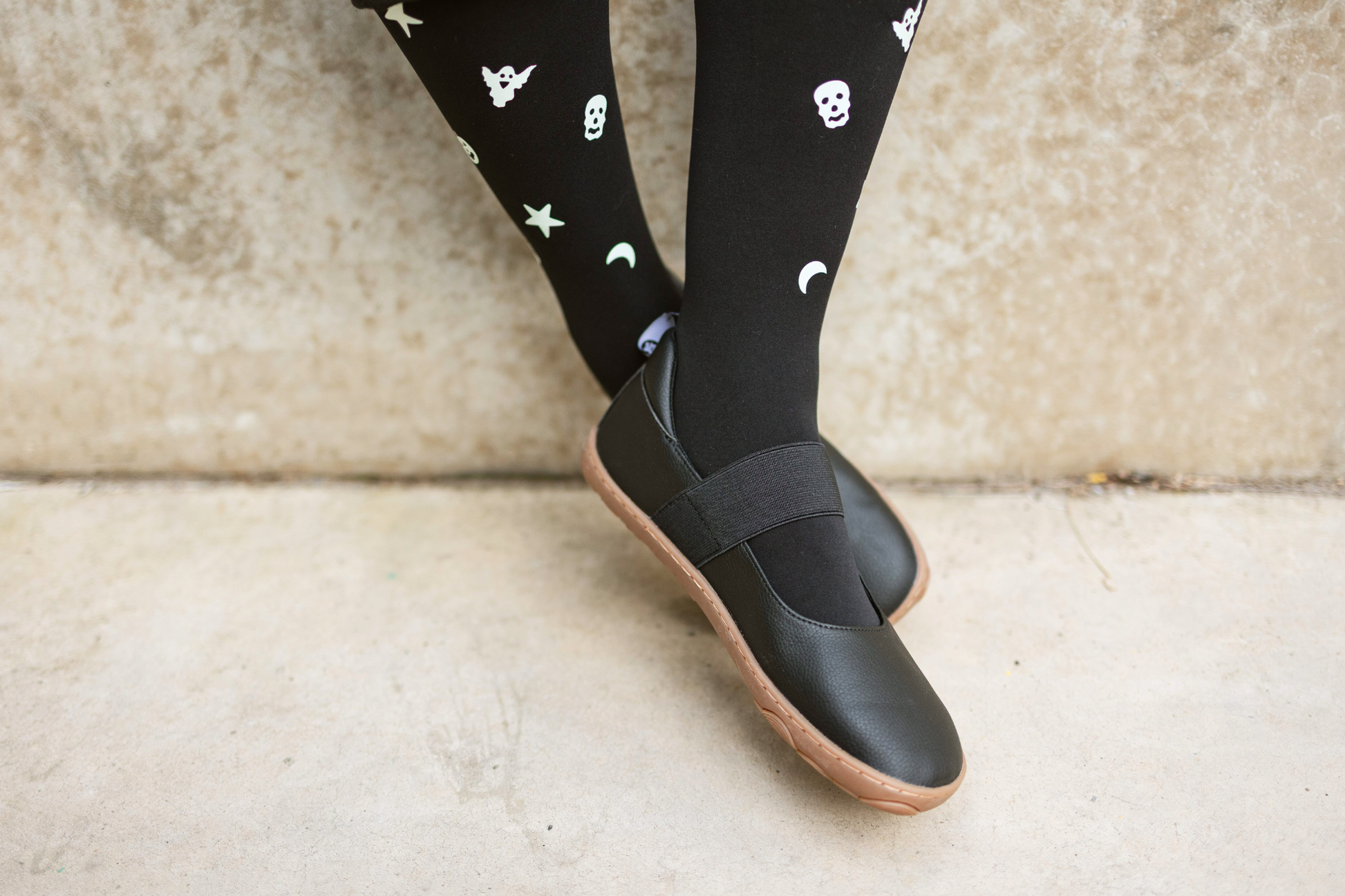 Legs dangling with black and gum maryjanes on from PaperKrane
