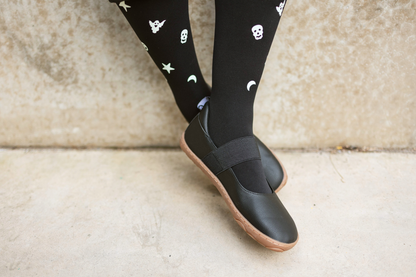 Legs dangling with black and gum maryjanes on from PaperKrane