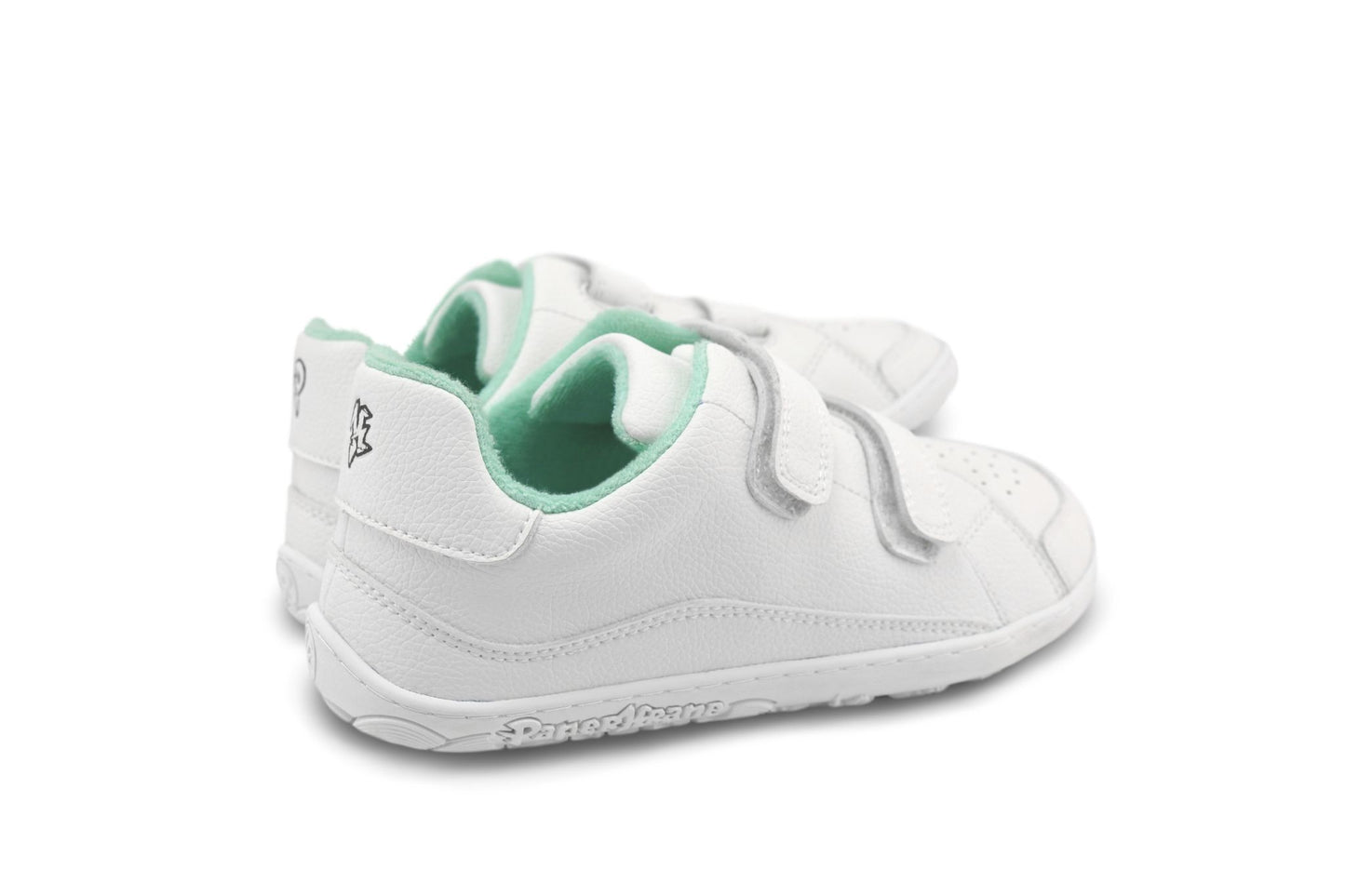 A pair of white children's barefoot PaperKrane sneakers with mint green terry cotton interior lining and hook-and-loop velcro strap closures, shown from a side-rear angle on a white background.
