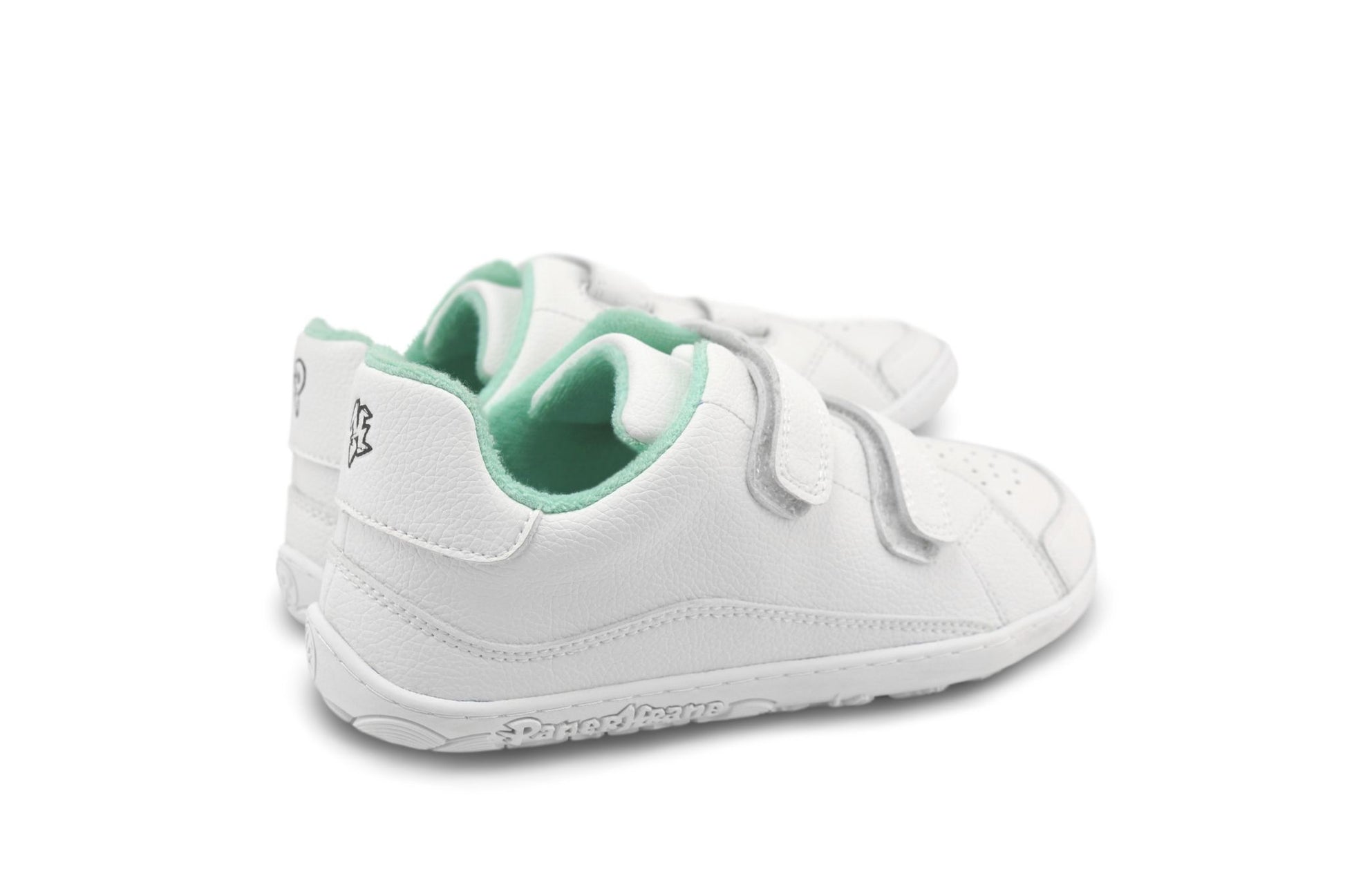 A pair of white children's barefoot PaperKrane sneakers with mint green terry cotton interior lining and hook-and-loop velcro strap closures, shown from a side-rear angle on a white background.