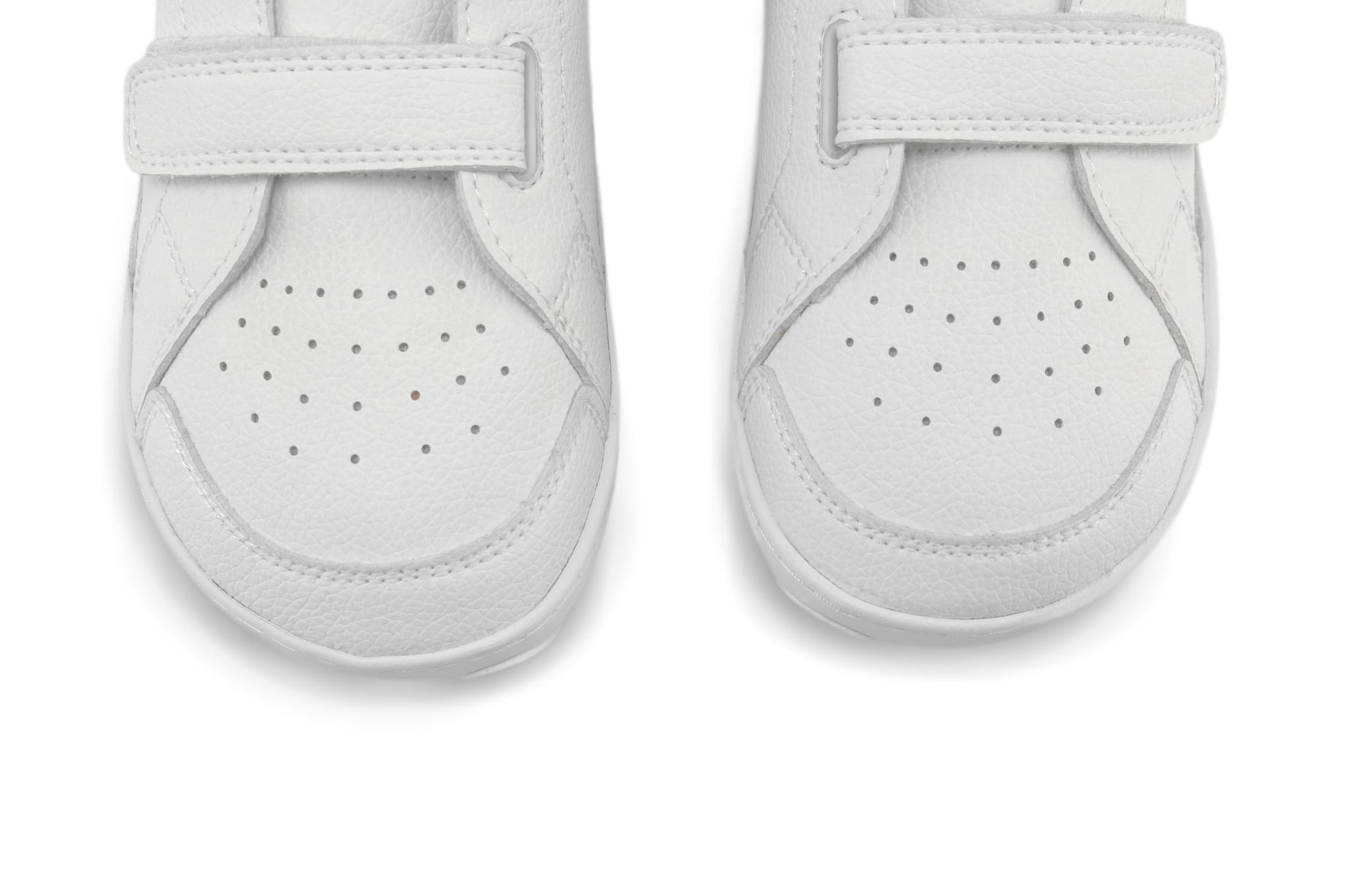 A pair of white PaperKrane foot-shaped vegan sneakers viewed from the toe end, featuring perforated uppers and wide hook-and-loop velcro strap closures, set against a plain white background.