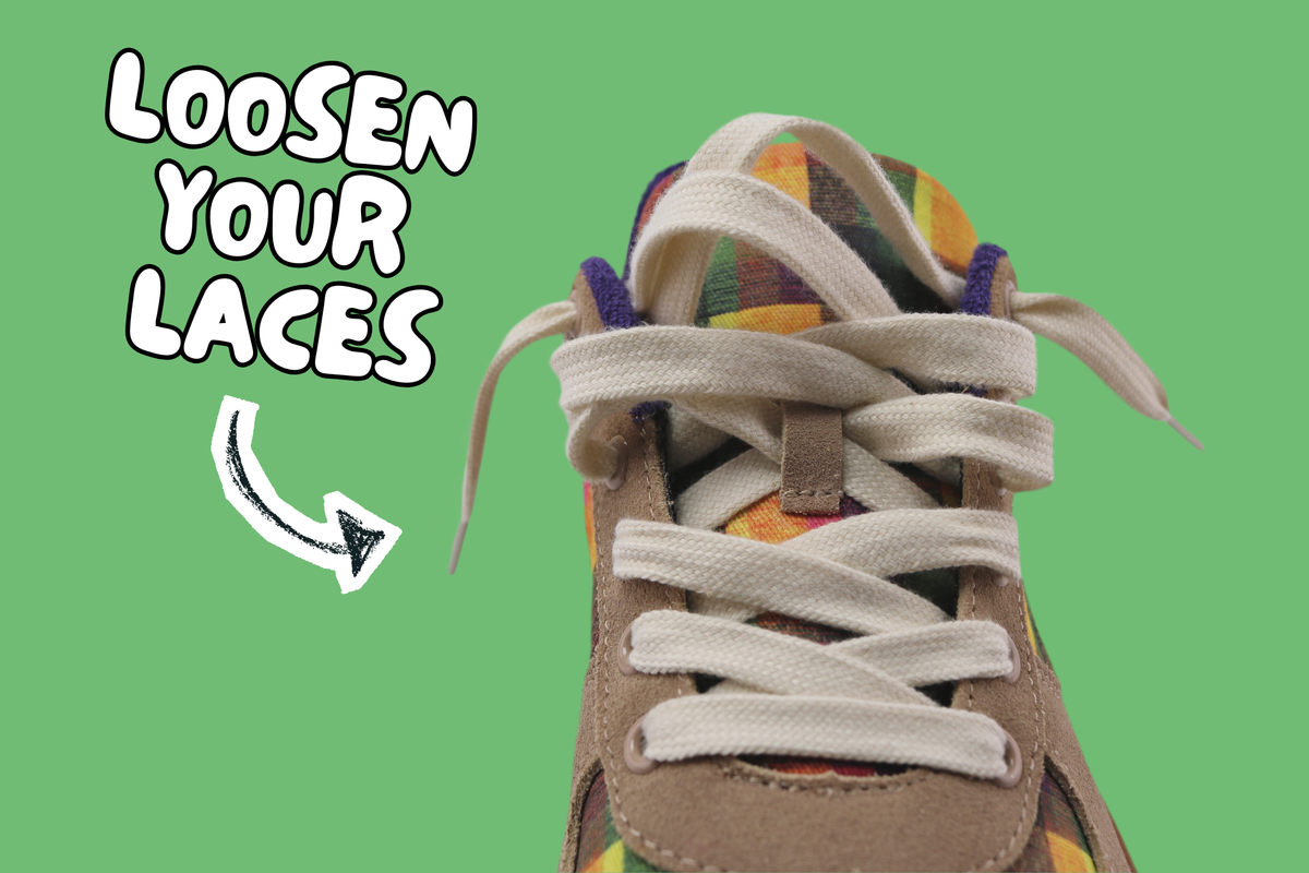 A close-up of a sneaker with off-white laces tied in a loose, untied fashion, set against a solid green background with the text 'LOOSEN YOUR LACES' and a hand-drawn arrow. To avoid further distress on the light cotton uppers, it's best to loosen laces when putting on or taking off this style. 