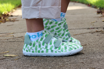 Velcro shoes with pickle pattern on a sidewalk