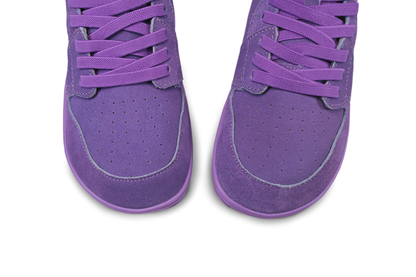Purple high tops with elastic laces on a white background