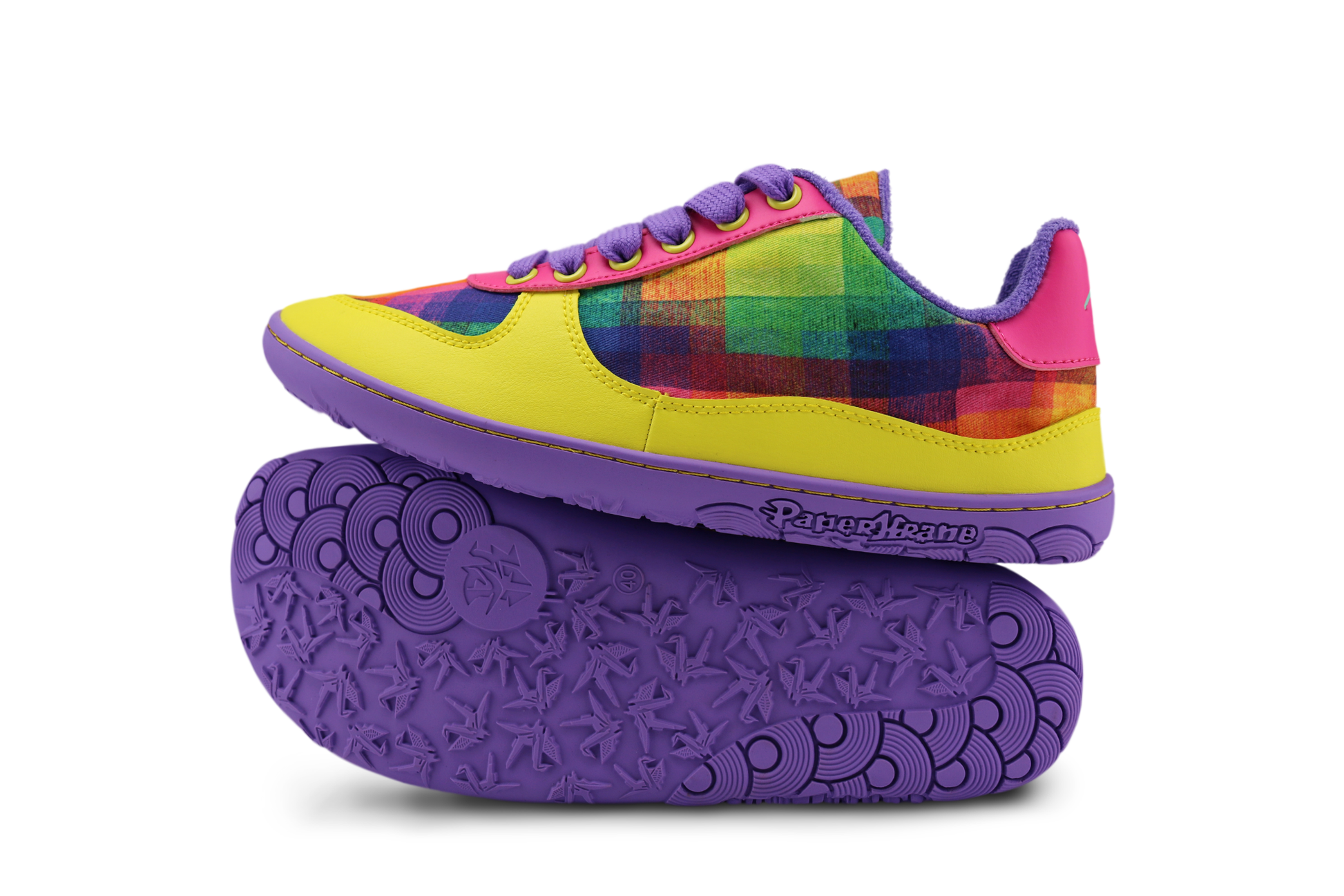 Colourful Di Nowinski plaid art print sneakers with purple sole, hot pink and yellow details on a white background