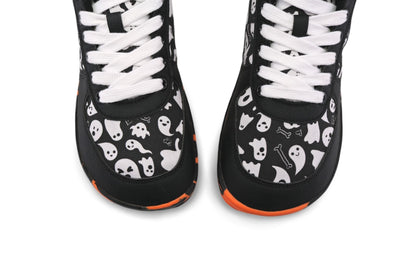 Black and white vegan foot-shaped sneakers viewed from above so we can see the shape of the toe box. These PaperKrane sneakers feature a black and white ghost print on cotton, with vegan leather details, on an orange and black rubber sole. 