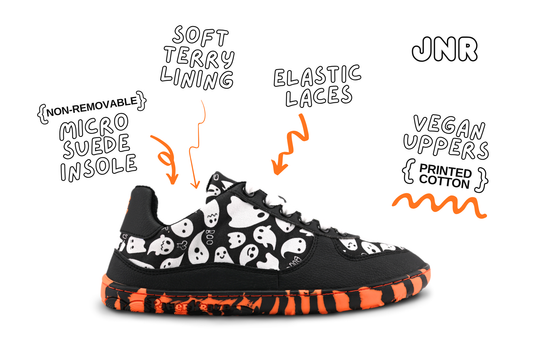A flat and flexible PaperKrane sneaker with orange and black striped soles, and ghosts printed on the upper, is seen from the side. The details around the shoe show it's features, and the JNR in the top right corner lets us know that these are the details of the kids pairs. Specifically that these have elastic laces. 