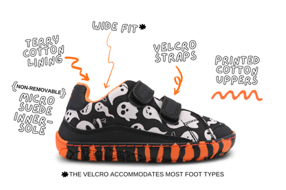 The LIL SPOOKY velcro sneaker from PaperKrane has a zero drop tiger-striped sole, with black and white ghost print upper. The background is white and there are product details around the shoe. This style is just available in JNR sizes. 