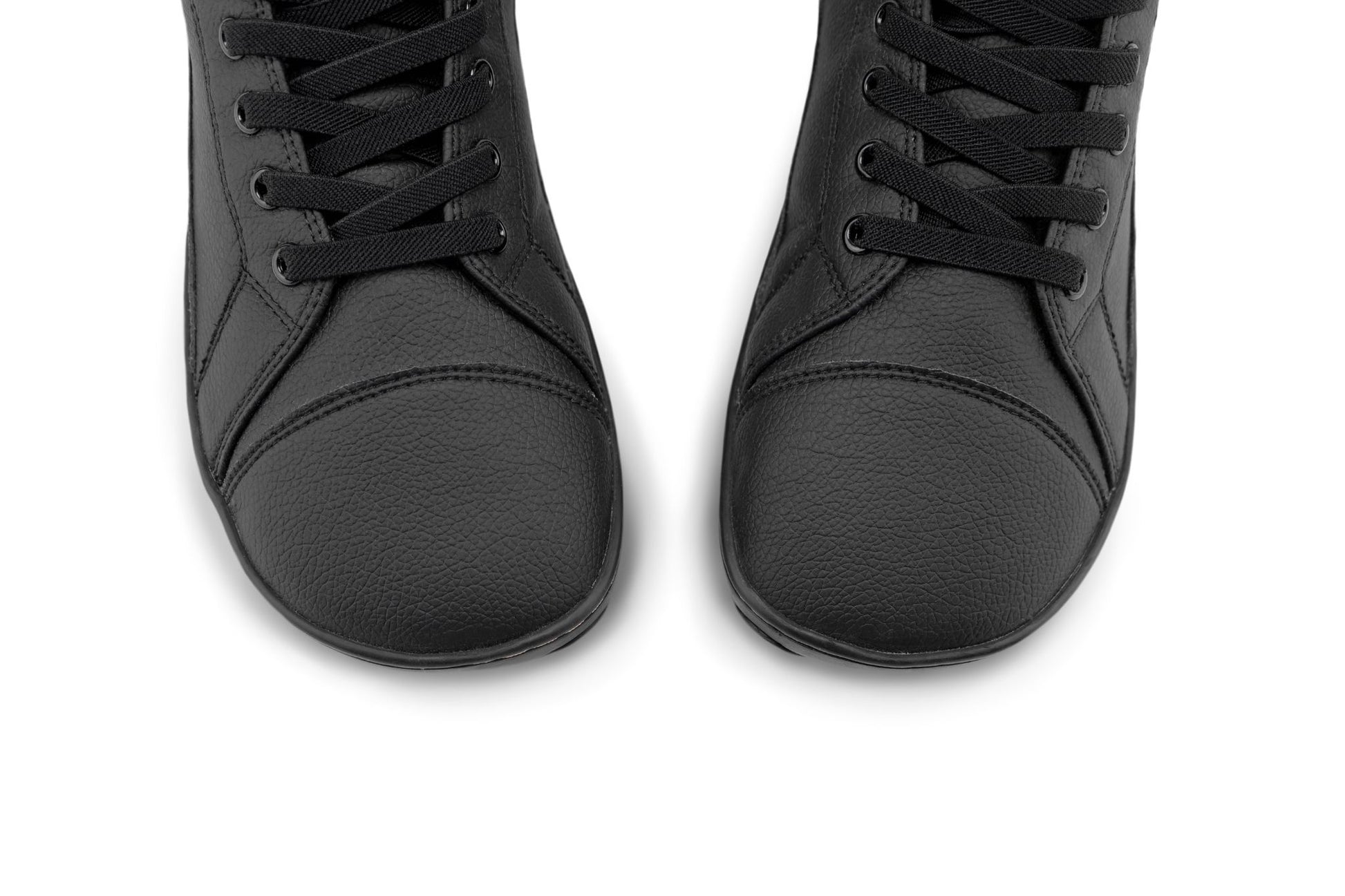 A pair of black vegan leather high-top lace-up shoes shown from a top-down angle on a plain white background.