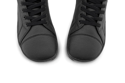 A pair of black vegan leather high-top lace-up shoes shown from a top-down angle on a plain white background.