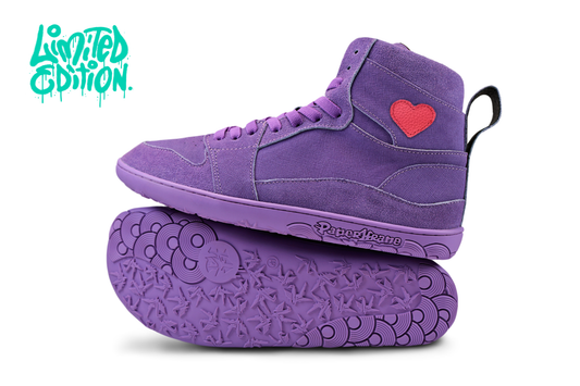 Purple leather high-top barefoot sneakers with a red heart on a white background, featuring "limited edition" in teal in the top left corner. These are a collaboration with JaMarr John Johnson.