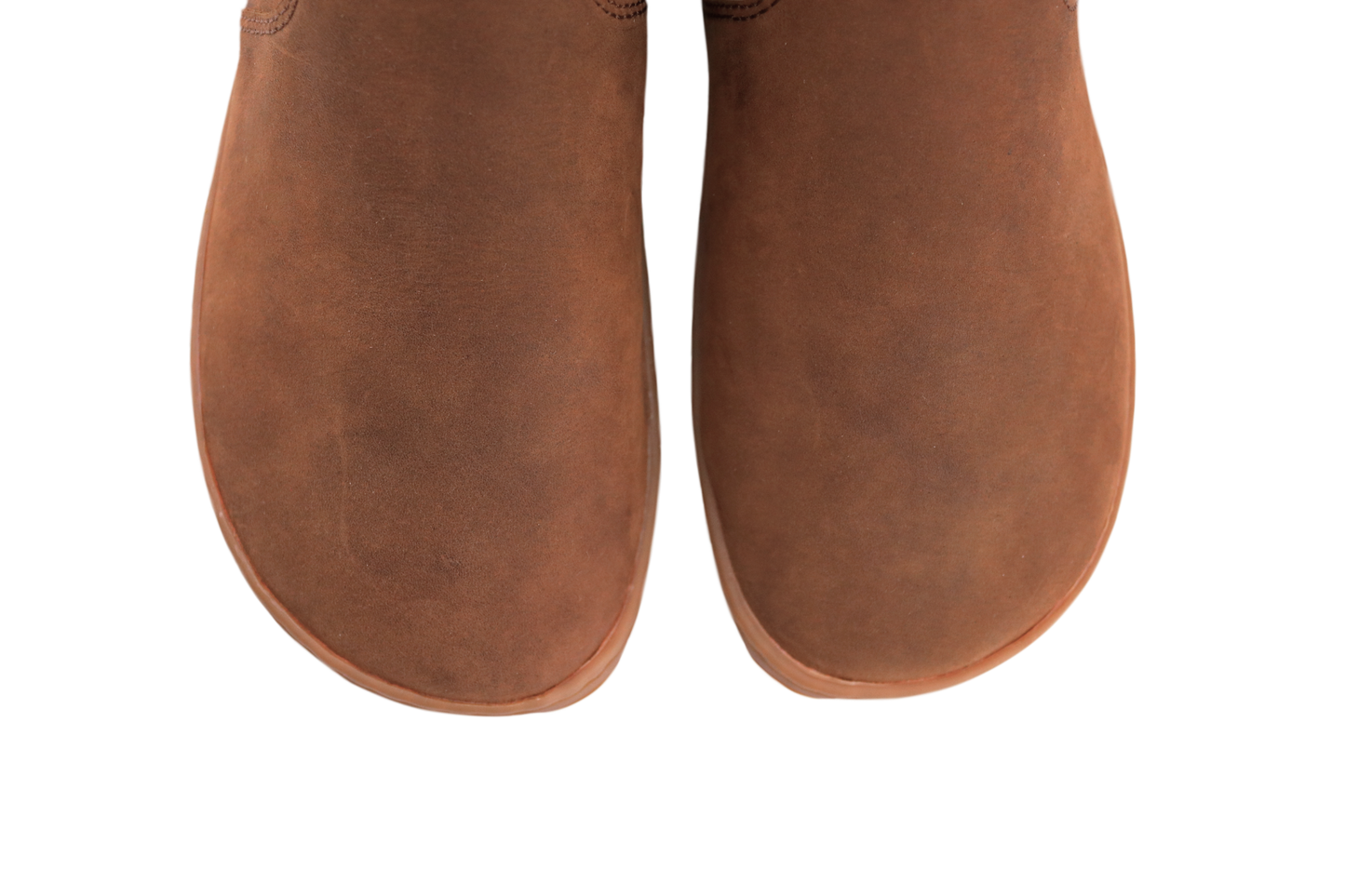 Pair of brown leather foot-shaped boots on a white background