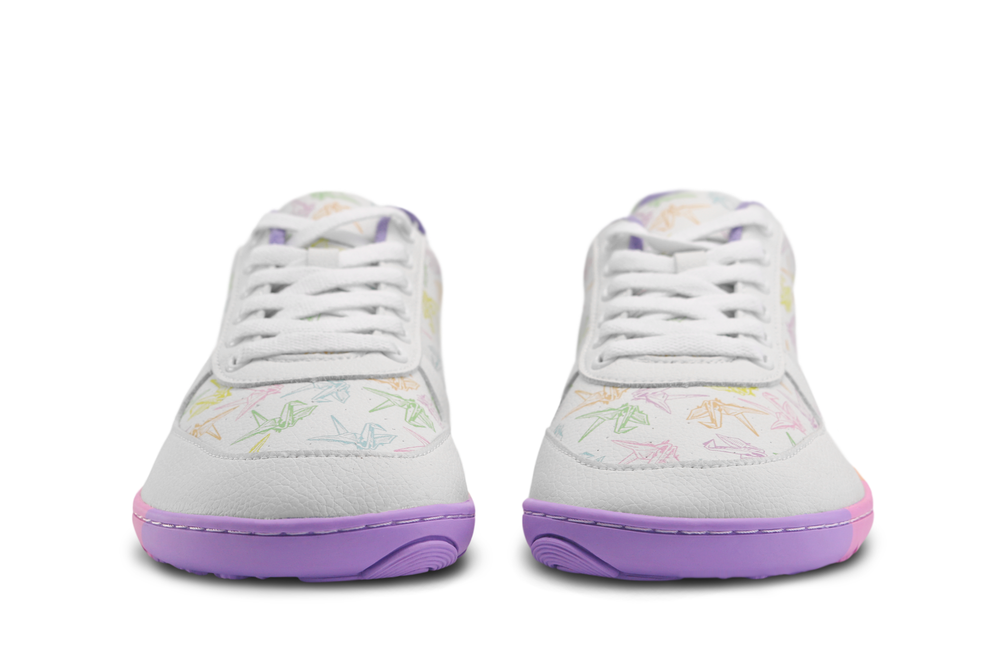 White barefoot sneakers from PaperKrane with a zero drop rainbow sole, and rainbow origami cranes printed on them. Seen from the front, you can see the toe box is wider. On a white background. 