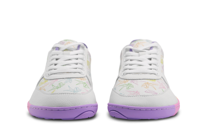 White barefoot sneakers from PaperKrane with a zero drop rainbow sole, and rainbow origami cranes printed on them. Seen from the front, you can see the toe box is wider. On a white background. 
