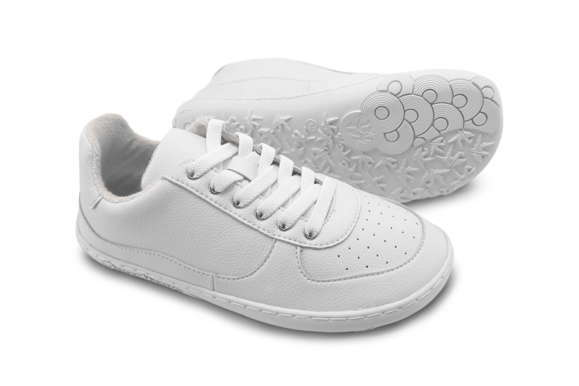 White sneakers with elastic laces on a white background
